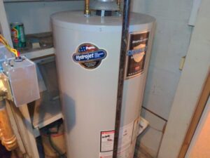 Typical natural draft water heater found while performing NJ home inspection.